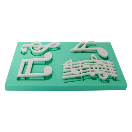 Müzik temalı silikon kalıbı: nota, sol anahtarı ve müzik notaları içeren kalıp.